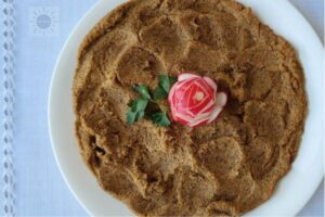Lentil Spread, Vegan "Chopped Liver" On A Serving Plate With A Radish Rose In The Middle.