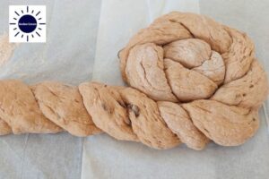 Wholegrain Honey Raisin Challah Recipe - Two Long Strands Twisted Together And Formed Into A Circle