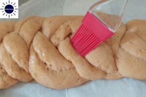 Wholegrain Spelt Vegan Challah Recipe - Honey Water Mixture Brushed On Top Of Dough