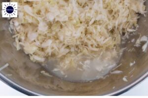 Cabbage In Large Bowl Letting Out Its Juices.