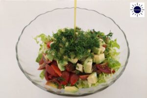 Mediterranean Lettuce Avocado Salad Recipe -Dressing Poured Over Salad