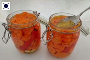 Mediterranean Pickled Carrots - Press Down Carrots With Tablespoon