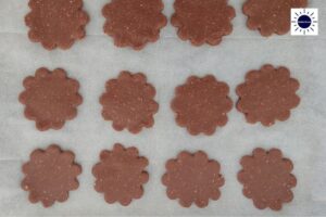 Scalloped Dough Circles On A Baking Sheet.