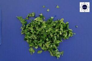 Diced Parsley On Cutting Board.