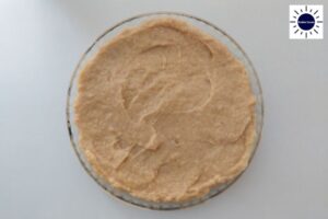 Filling Covering The Pie Crust In The Pie Dish.