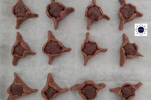 The Prepared Hamantashen On A Baking Sheet Before Baking.