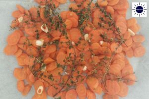 Carrots Mixed With Flavoring And Spices In A Baking Pan.