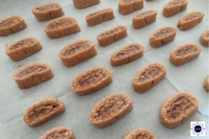 The Cut Cookies Spread On A Baking Sheet Before Baking.