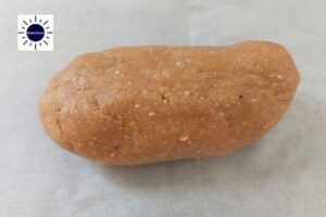 An Oblong Shape Made From The Cookie Dough On A Baking Sheet.