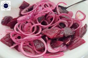 Beet Salad Mixed And Ready To Garnish In A Bowl With A Tablespoon.