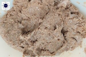 Closeup Of Dough With The Kosher Create Sun Logo In The Upper Left Corner.