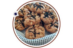 Wholegrain Vegan Onion Soda Bread Rolls Arranged In A Circular Fashion On A Silky Polka Dot Cloth That’s Suited For Breakfast Within A Decorative Circle Adorned With The Kosher Create Sun Logo.