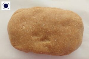 Dough In Oblong Shape With The Kosher Create Sun Logo In The Upper Left Corner.