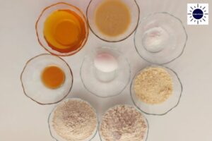 Wholegrain Almond Apricot Bars Dough Ingredients In Glass Bowls With The Kosher Create Sun Logo In The Upper Right Corner.