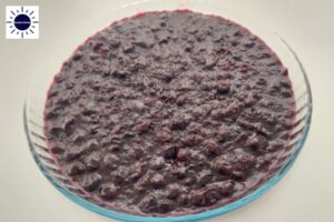 Wholegrain Lemony Blueberry Pie Filling In A Round Glass Dish With The Kosher Create Sun Logo In The Upper Left Corner.