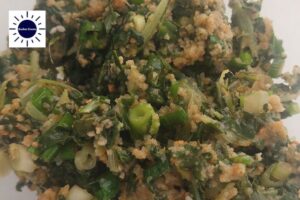 A Closeup Of The Chard Mixture Ready to Refrigerate With The Kosher Create Sun Logo In The Upper Left Corner.