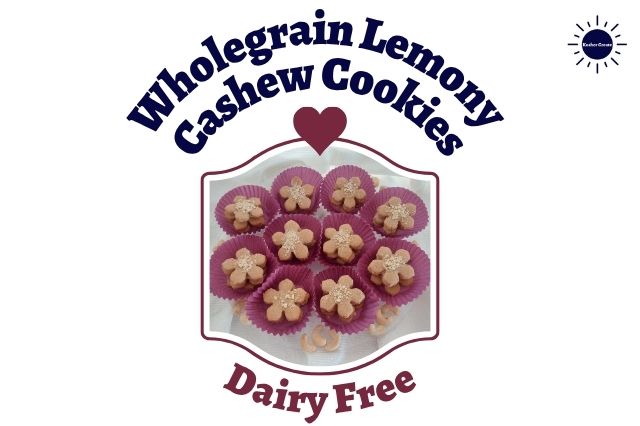 Wholegrain Lemony Cashew Cookies Stacked In Colorful Cupcake Holders Arranged On A Serving Plate Like A Flower With Assorted Cashew Nuts Around Whin A Decorative Frame With The Inscription Dairy Free Below And A Graphic Heart Above And With The Kosher Create Sun Logo In The Top Left Corner.